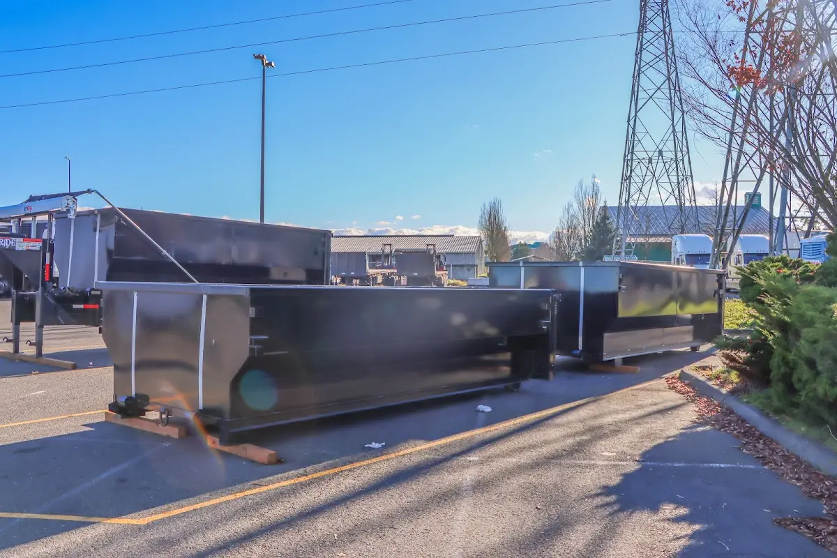 Roll-off dumpster ready for waste disposal at job site for 2 Yard Dumpster Rental in Olive Branch